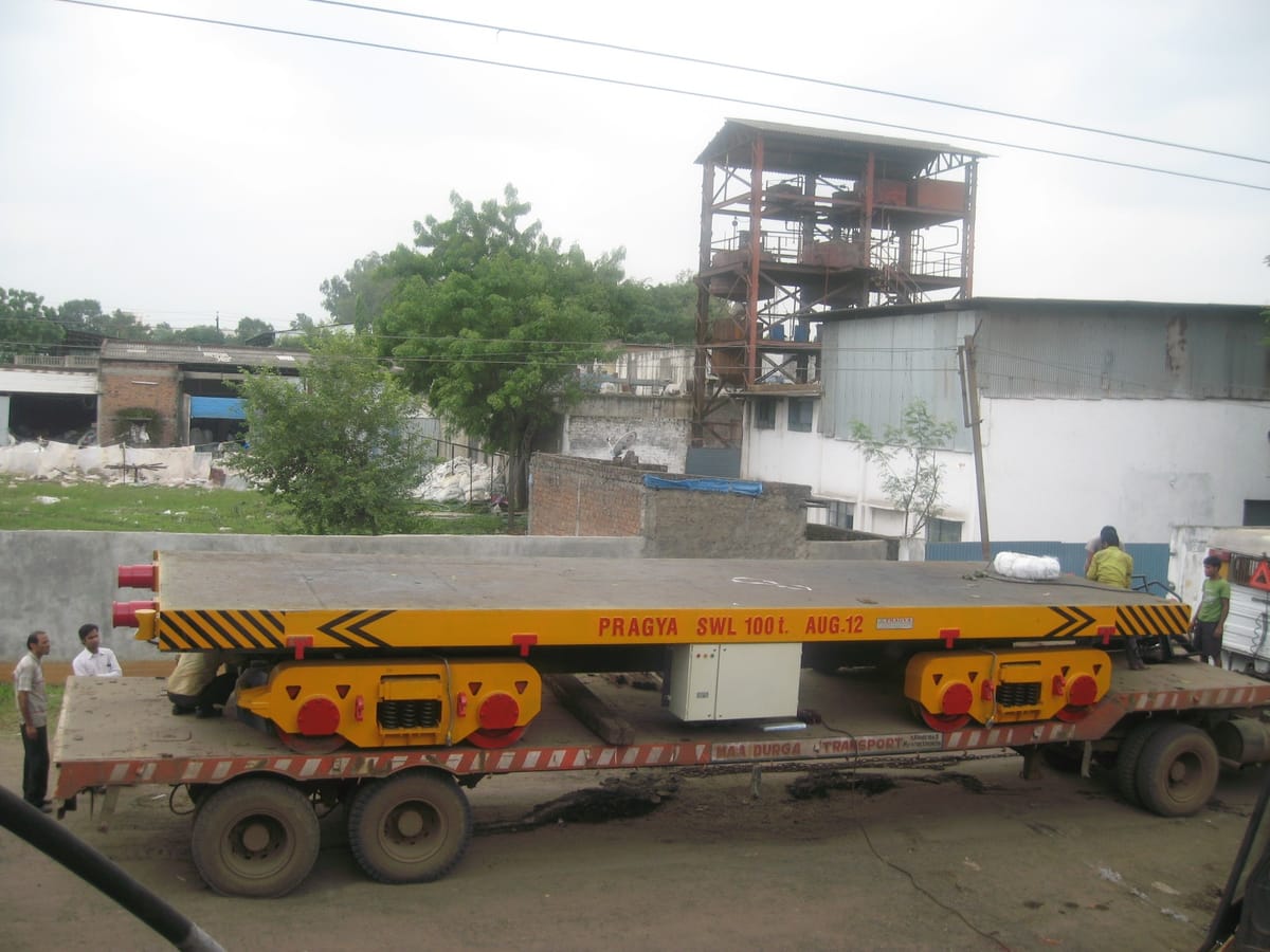 Motorised transfer trolley for steel coil movement — Pragya Precision Equipment